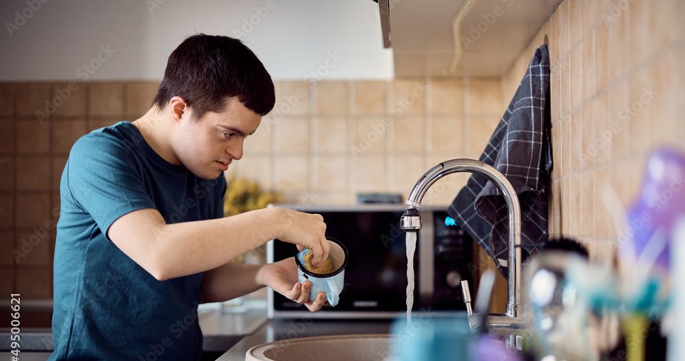 Young man washing up